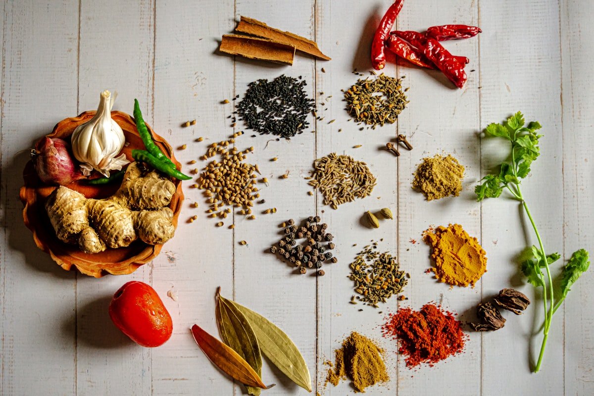 Assorted whole spices and spice powders at Mangla Trading Co.